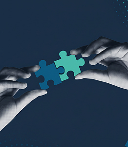 Two hands connecting teal puzzle pieces on a dark blue background