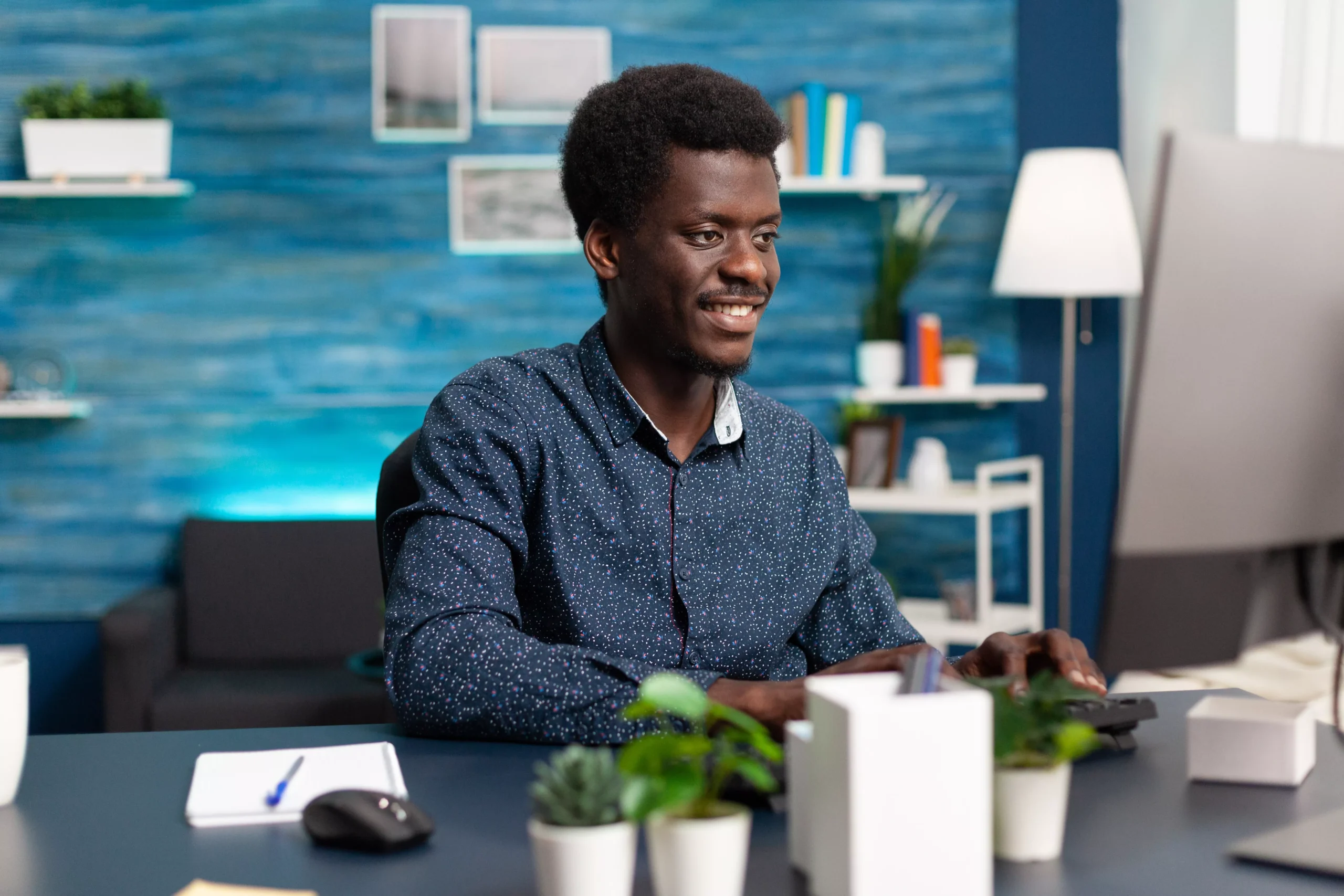 black-man-computer-user-working-from-home-at-cozy