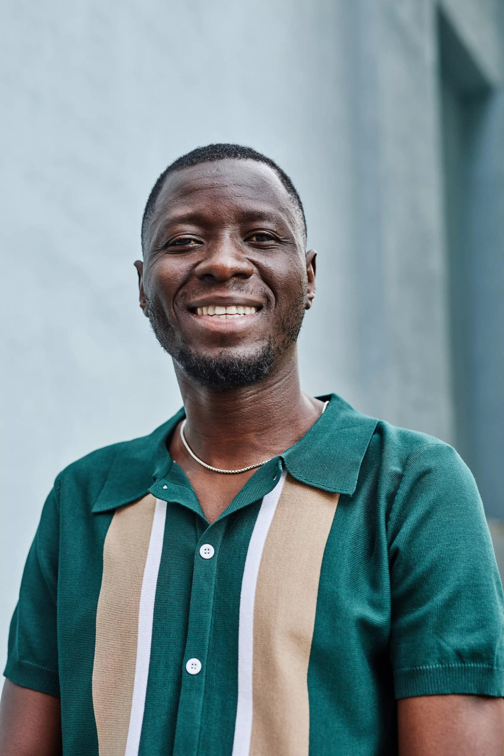 black-man-smiling-happily-at-camera