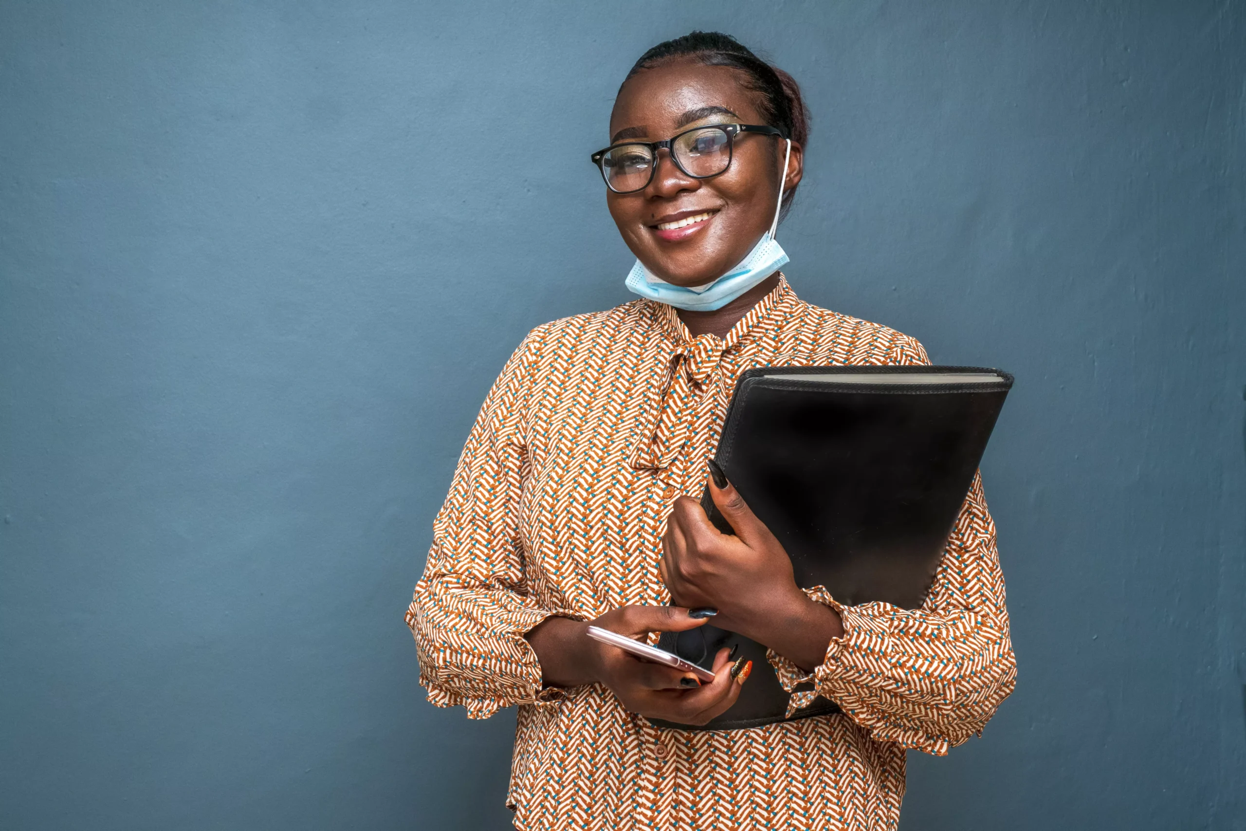 closeup-shot-of-a-young-lady-holding-a-file-of-doc