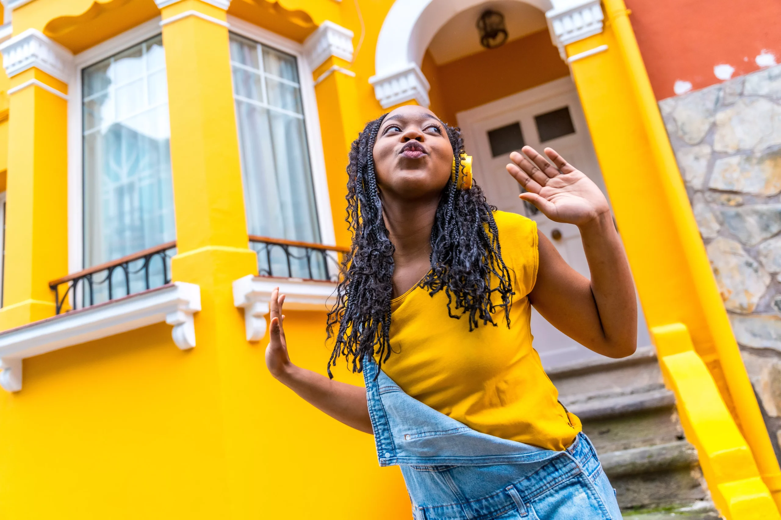 cute-african-woman-dancing-listening-to-music-with