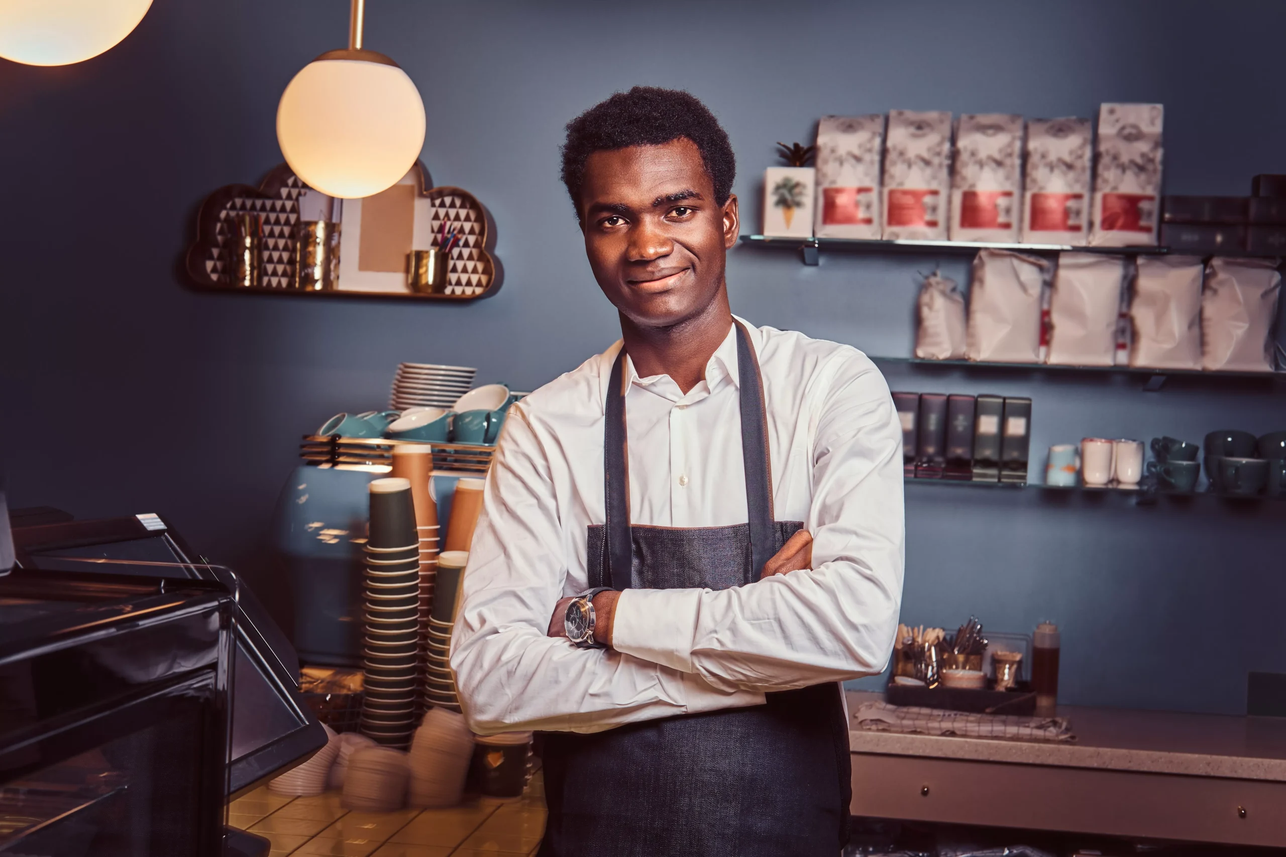 handsome-african-barista-at-coffee-shop