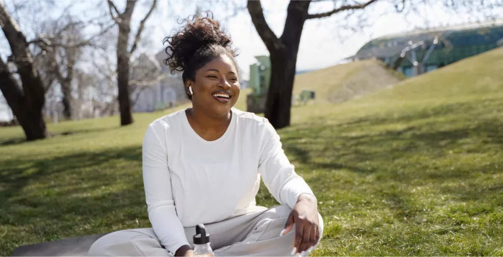 full-shot-smiley-woman-yoga-mat