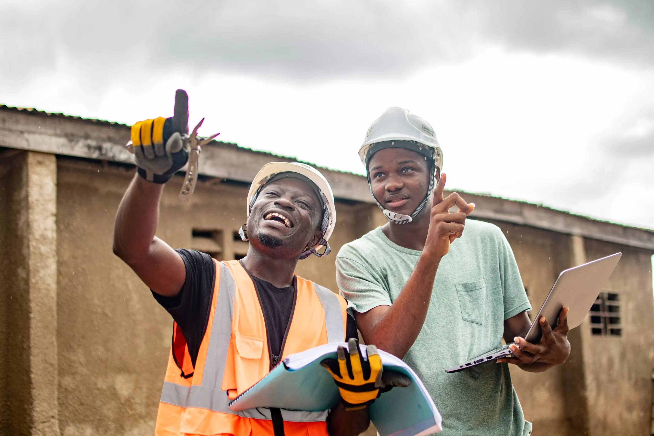 male-construction-workers-in-hard-hats-and-yellow