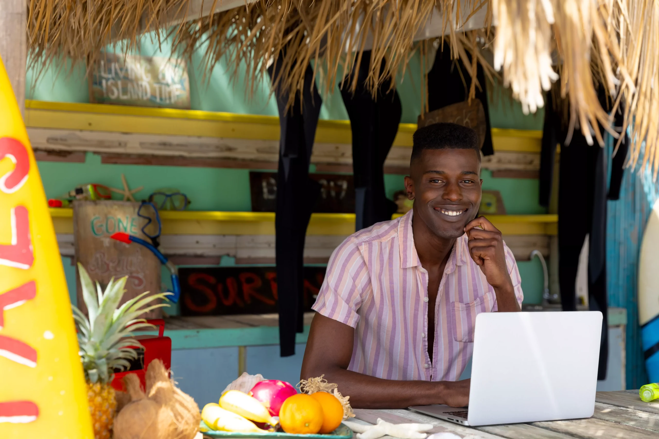 portrait-of-happy-african-american-man-using-laptop