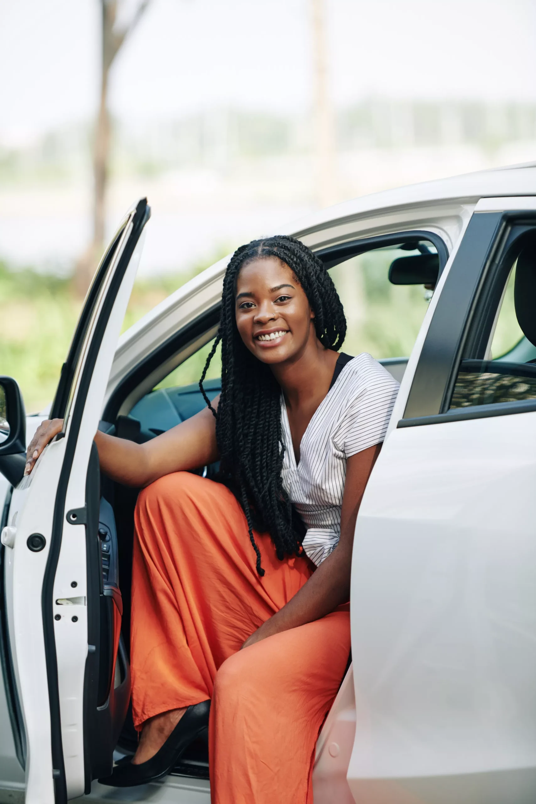 smiling-woman-sitting-in-new-car