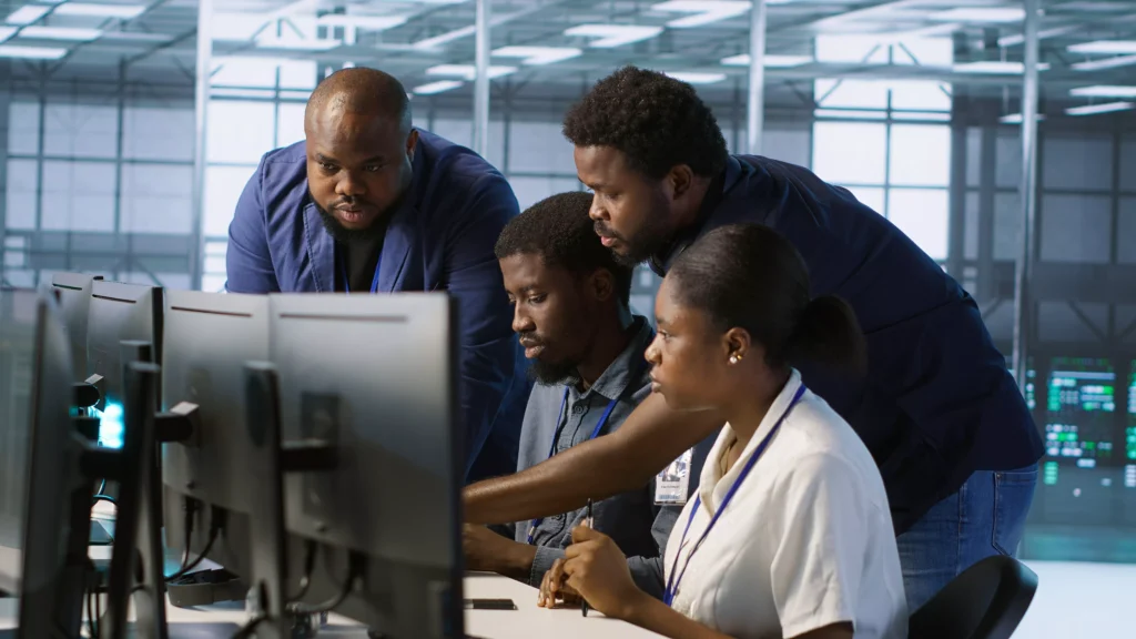 teamworking-engineers-talking-in-server-room-doin