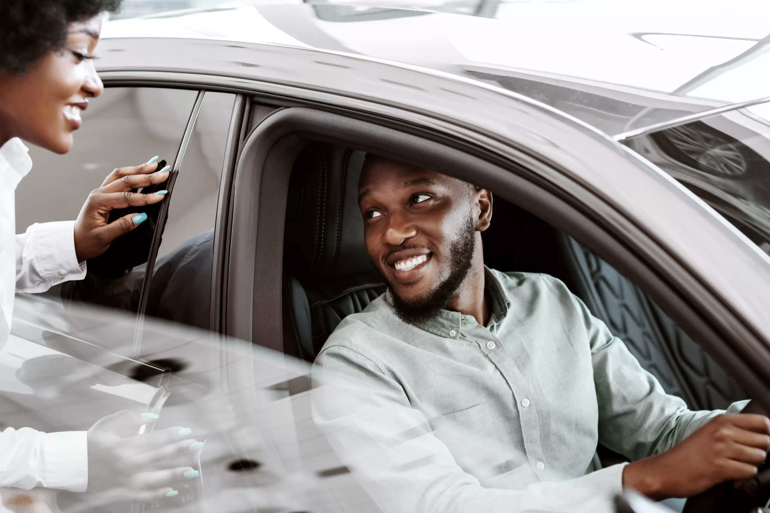 test-drive-black-man-sitting-in-driver-seat-of-ne