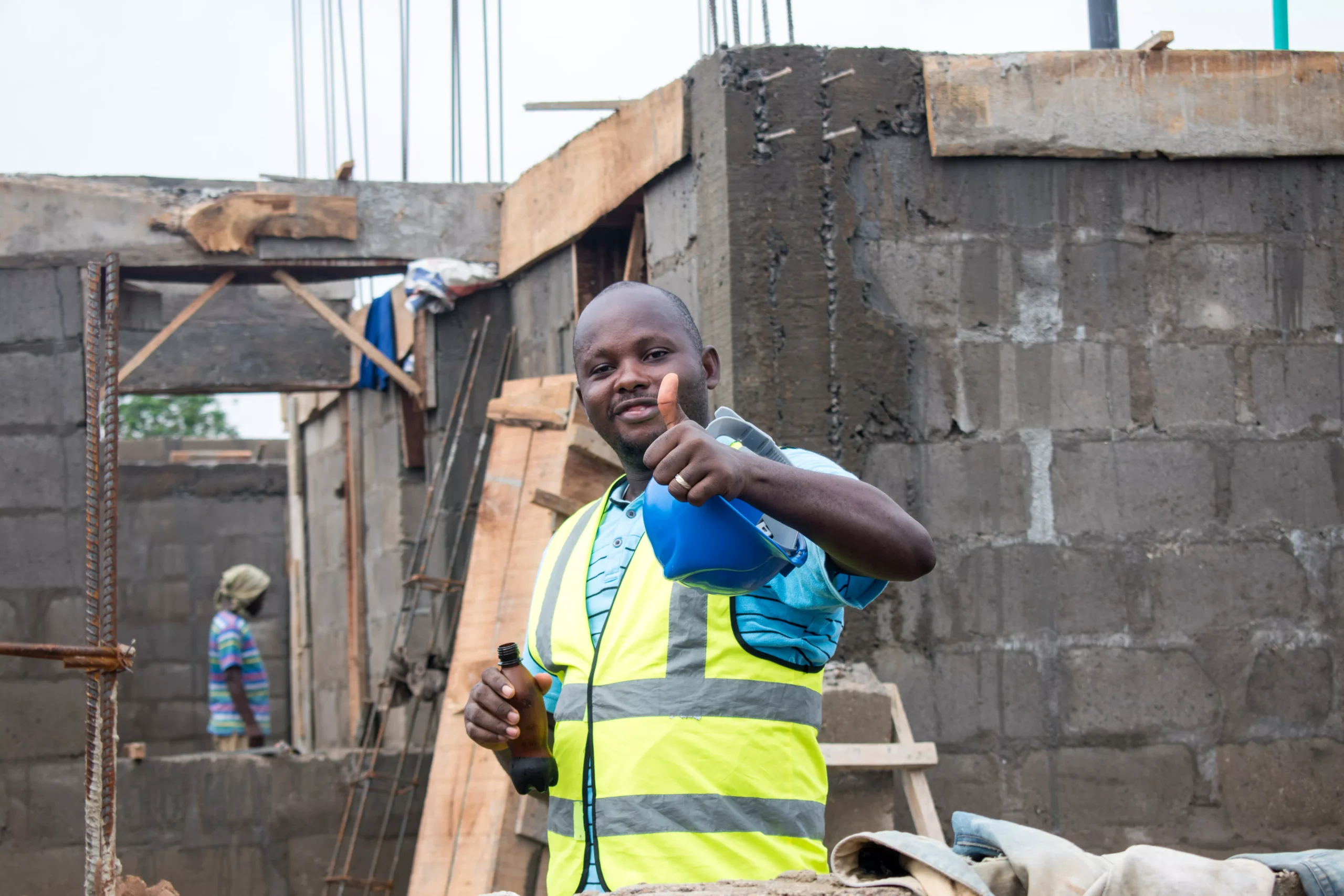 view-of-a-builder-with-a-blue-helmet-bootle-in-hi