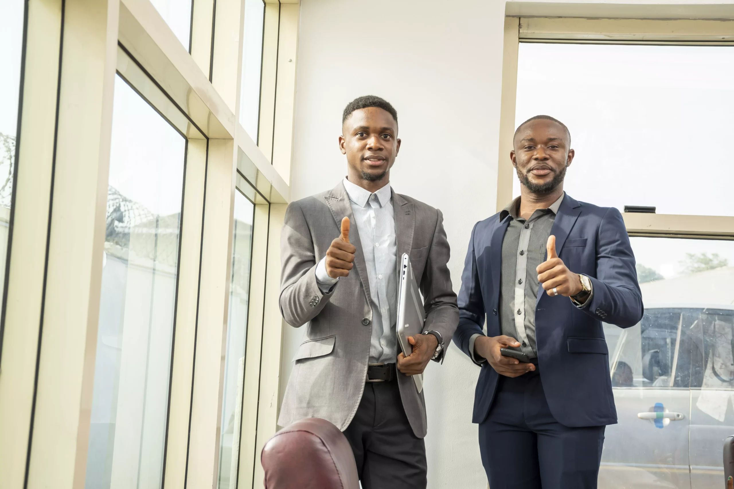 young-black-businessmen-standing-together-giving