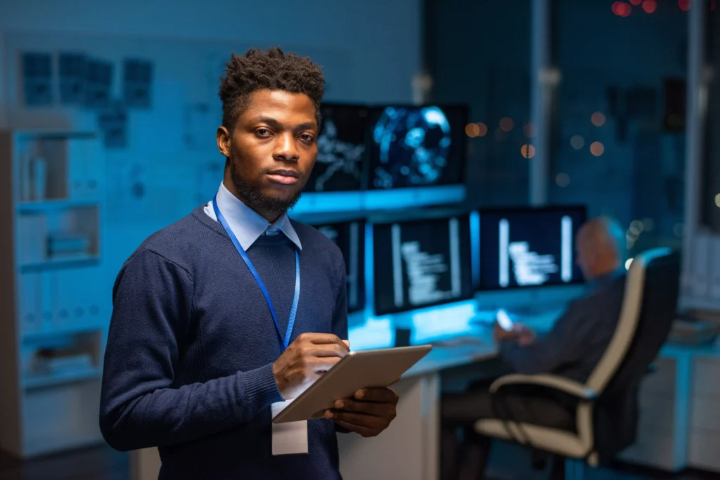 young-serious-african-programmer-with-tablet