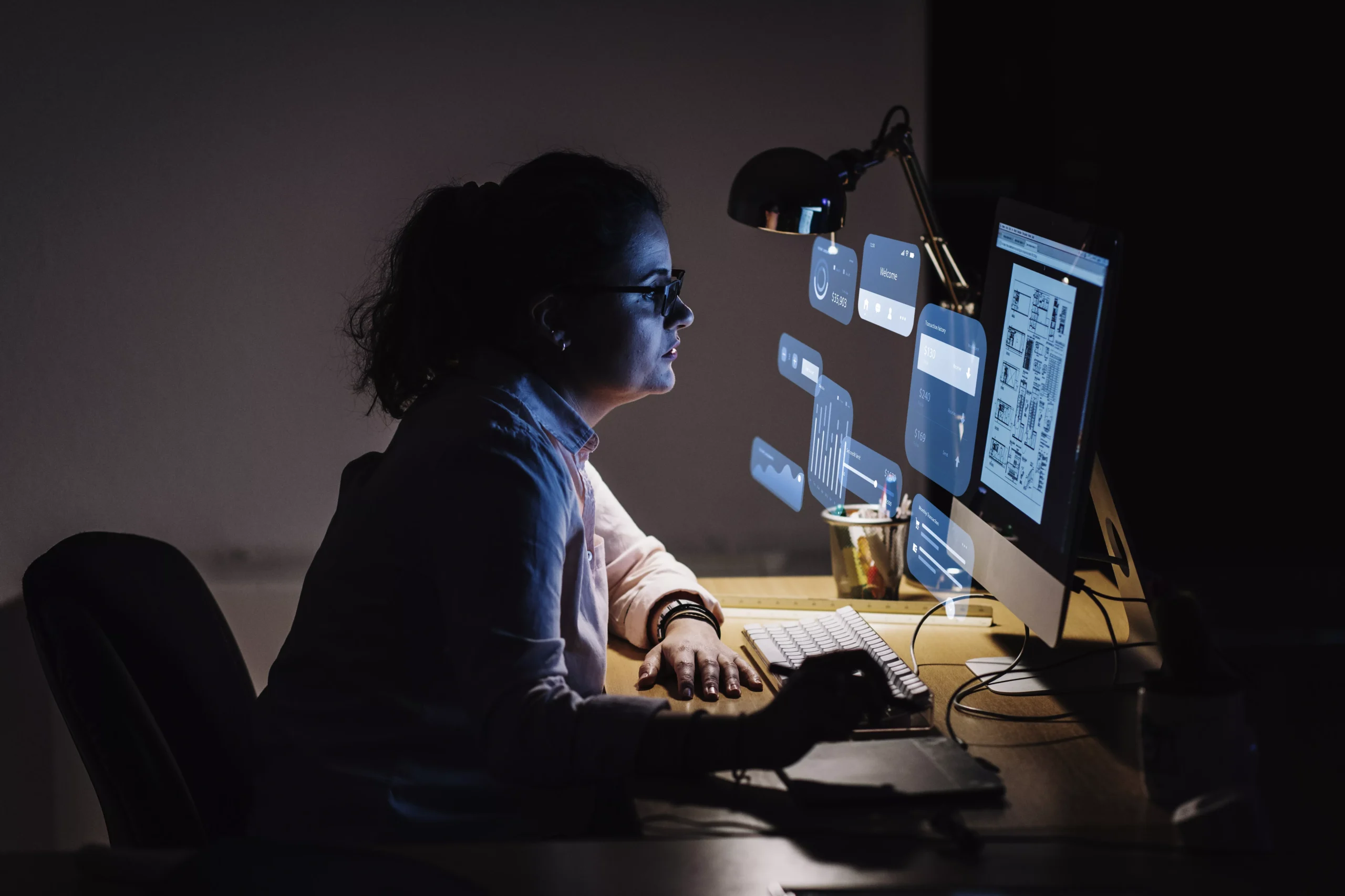 Designer working at computer creating prototype.